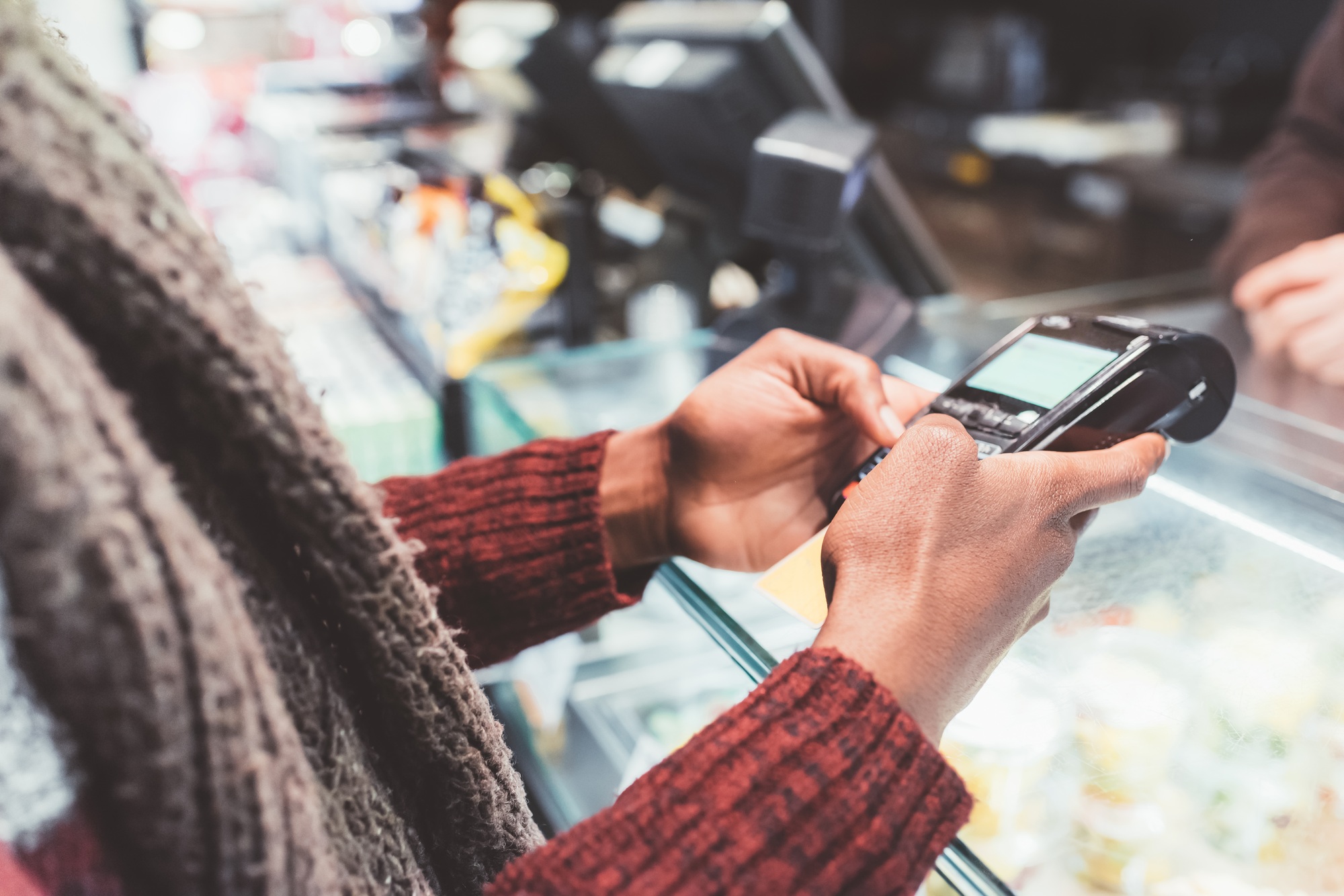 close up of person paying bill with credit card